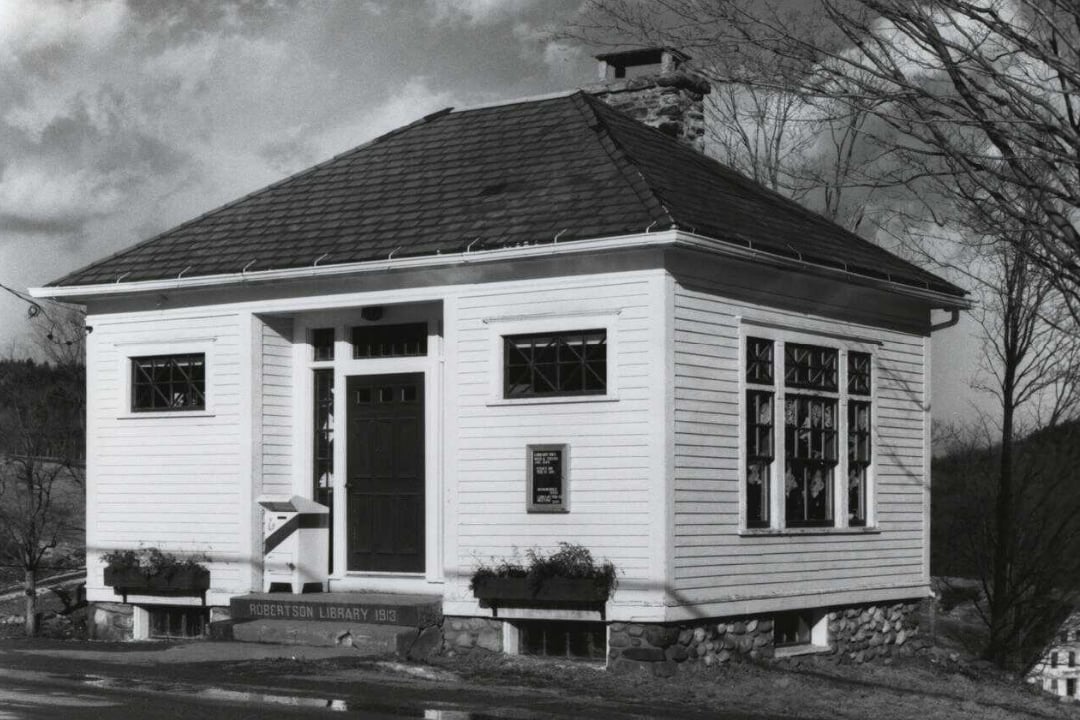 Historic photograph of Robertson Library, a stone building with arched windows